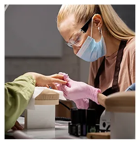 nail art professional working client nails